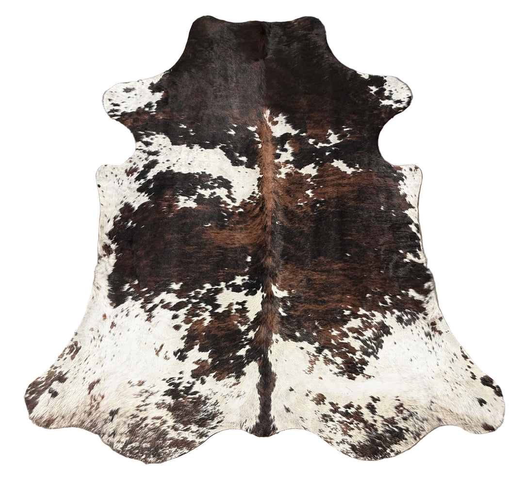 Brown and white cowhide rug