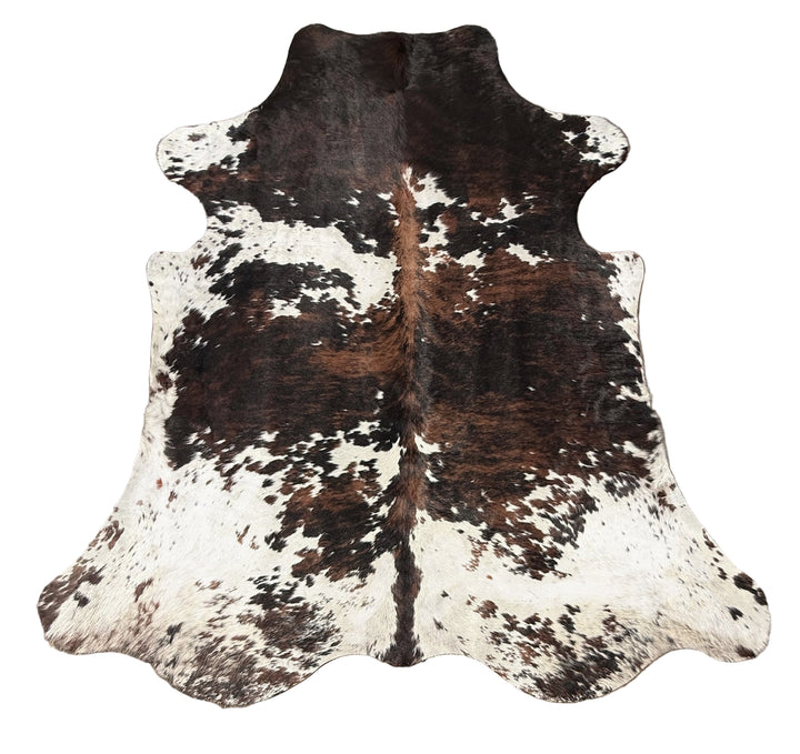 Brown and white cowhide rug