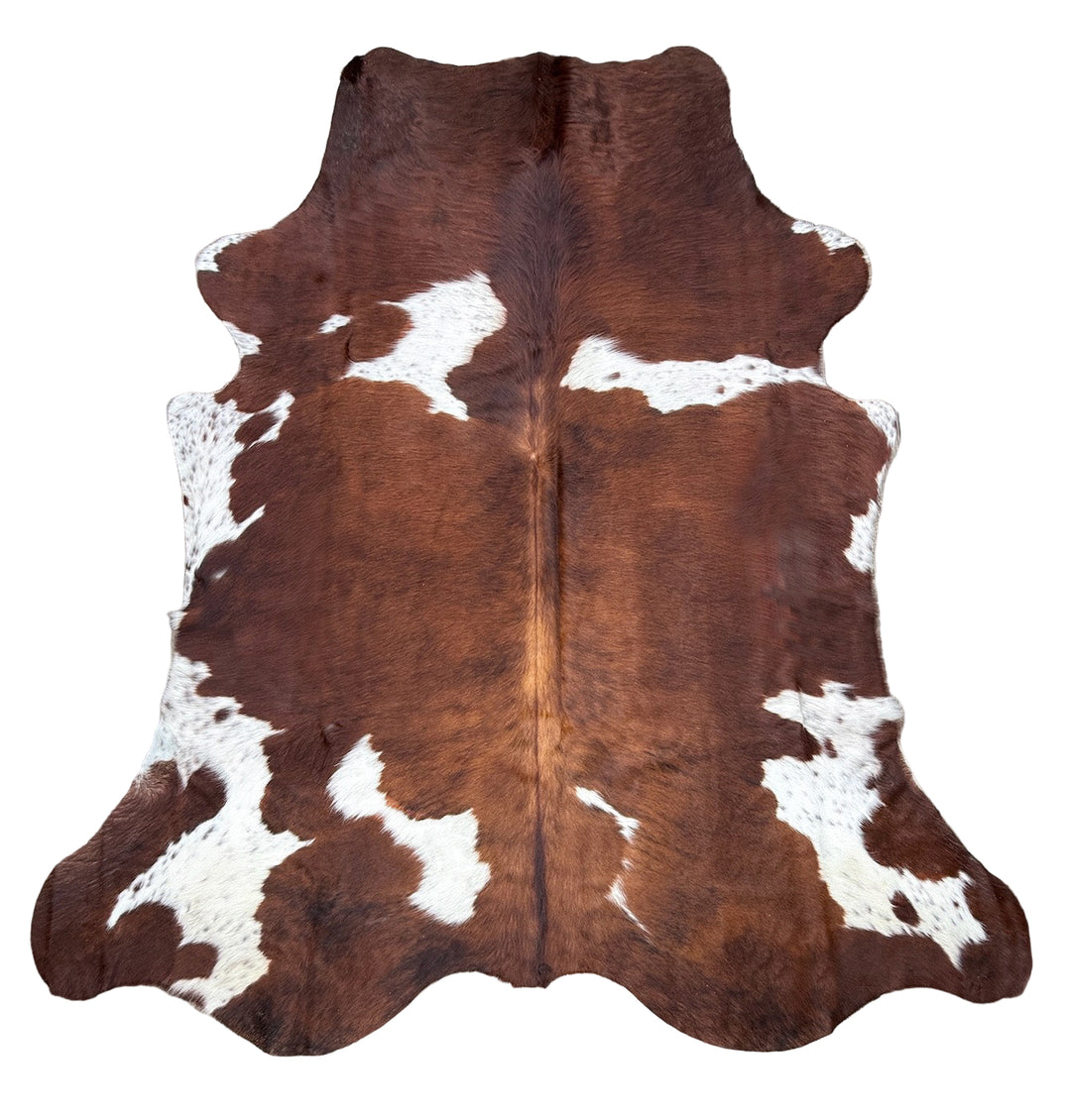 Brown and white cowhide rug
