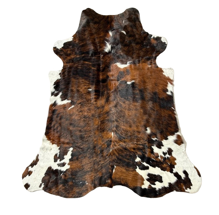 Brown and white cowhide rug