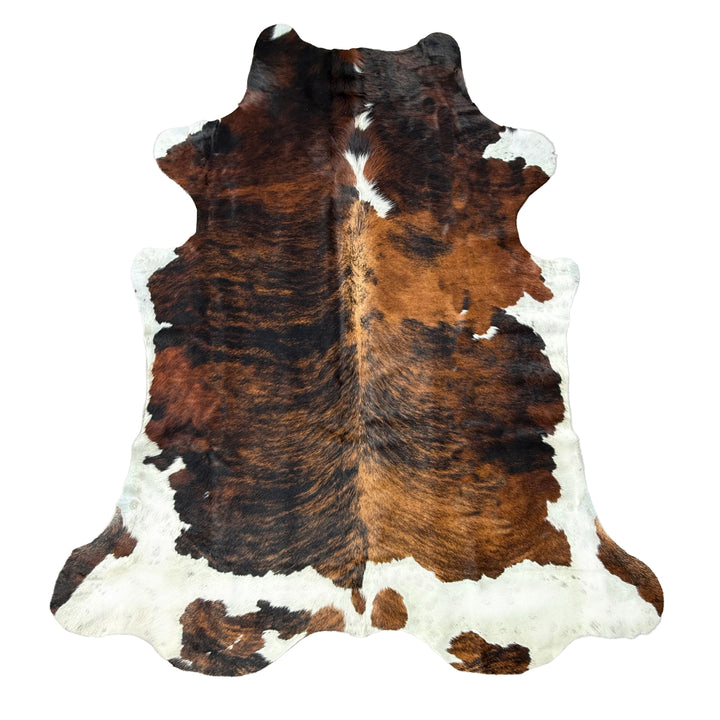 Brown and white cowhide rug