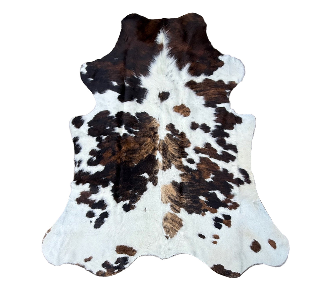 Brown black and white cowhide rug
