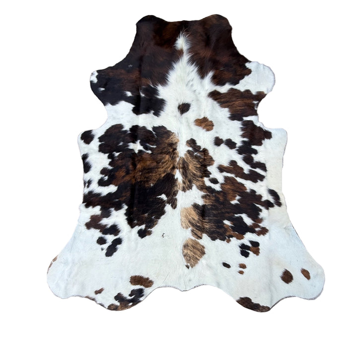 Brown black and white cowhide rug