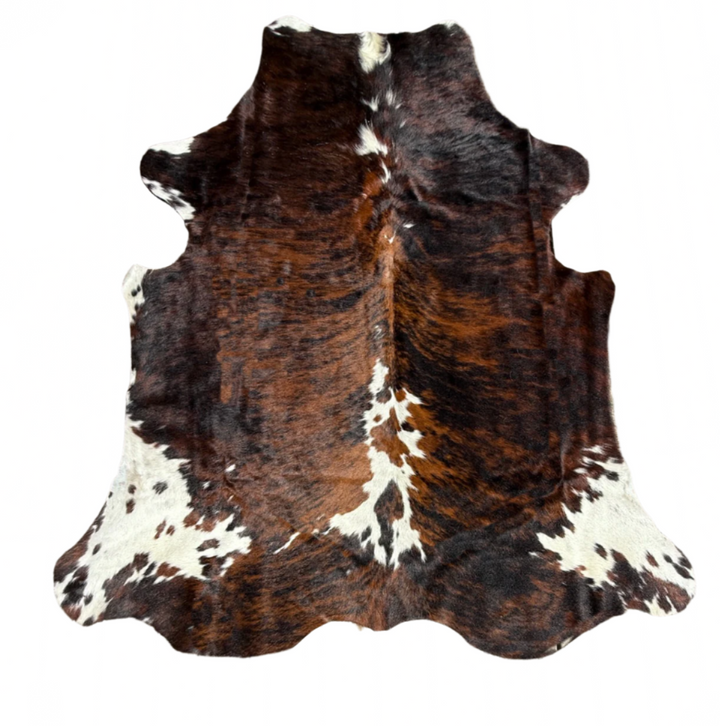 Brown and white cowhide rug