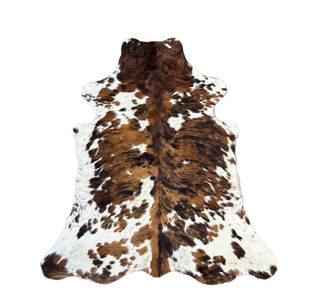 Brown and white cowhide rug