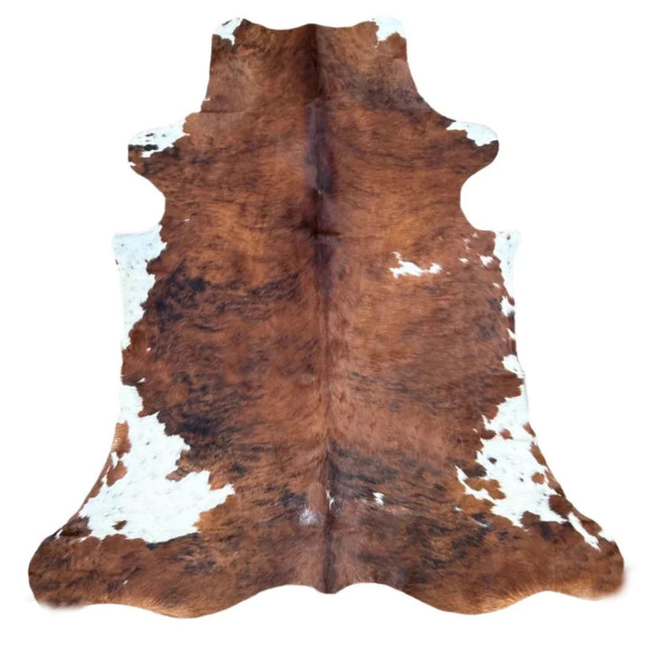 Brown and white cowhide rug o