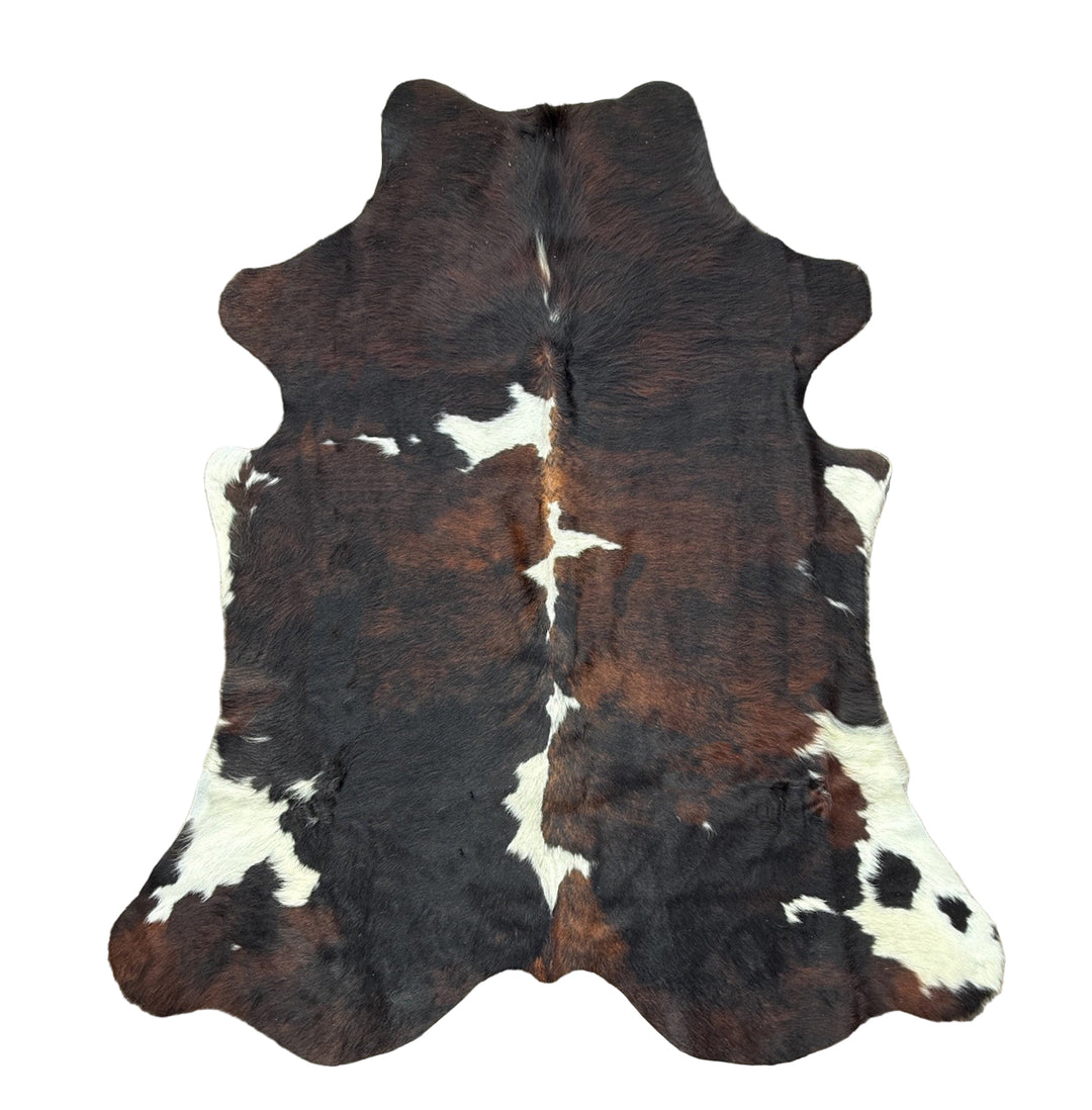 Cowhide rug with brown, black, and white 