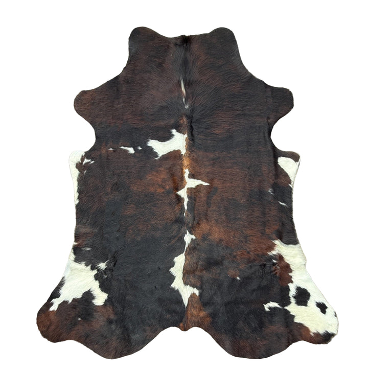 Cowhide rug with brown, black, and white 