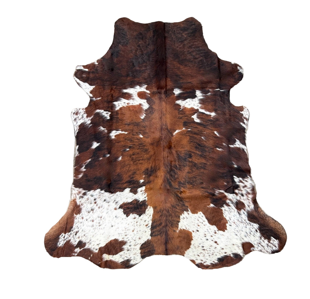 Brown and white cowhide rug o