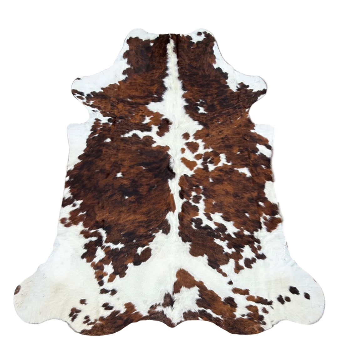 Brown and white cowhide rug 