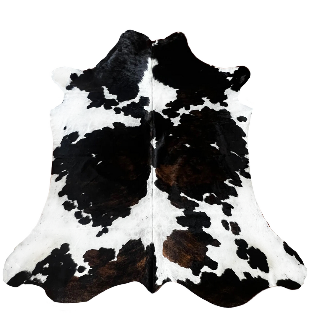 Black and white cowhide rug with natural hair-on-hide pattern,