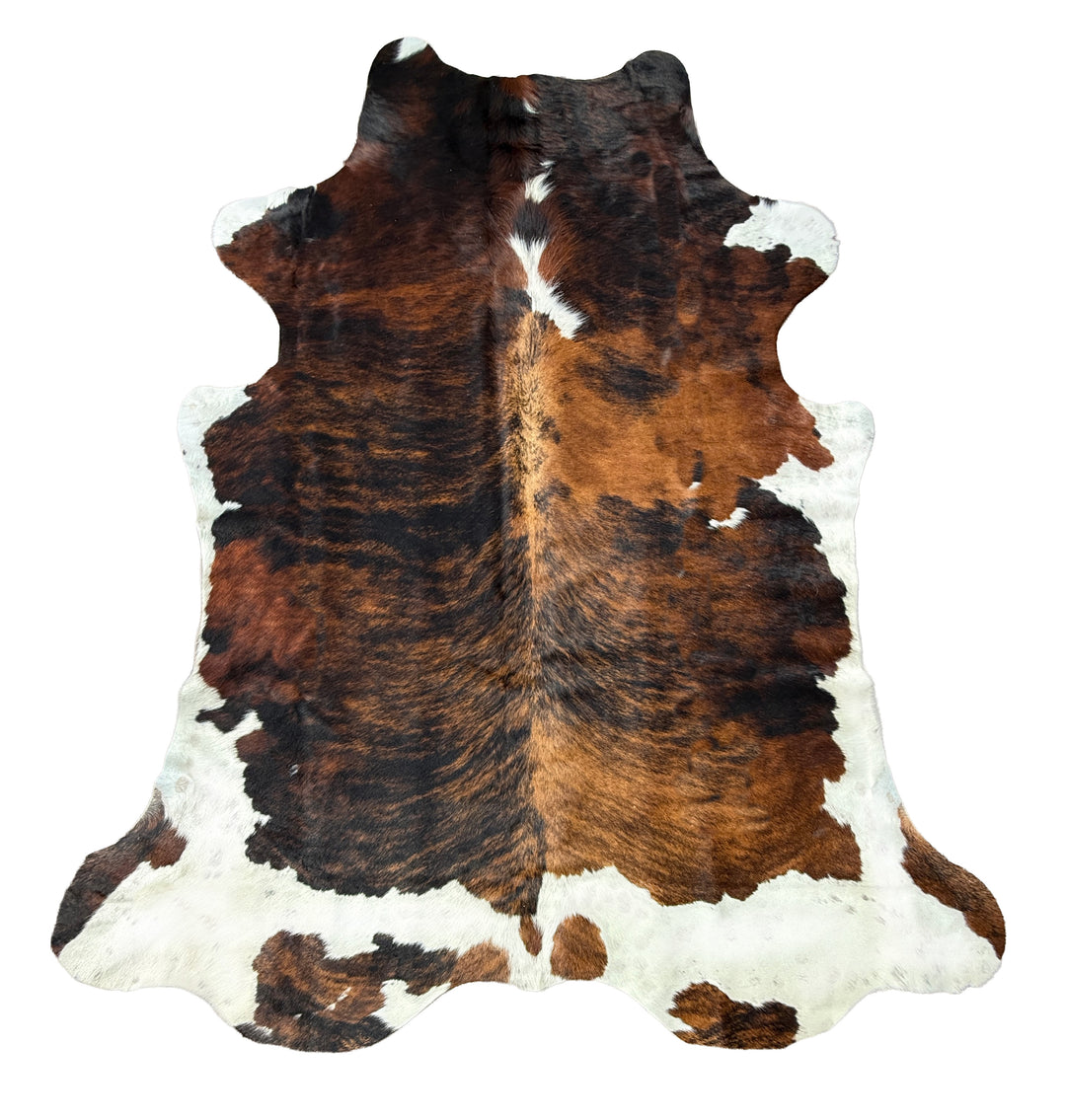 Brown and white cowhide rug