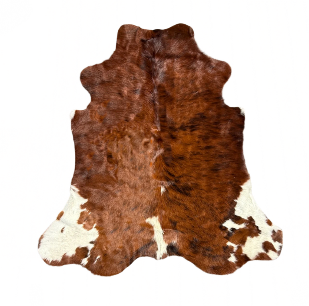 Premium cowhide rug in natural brown and white, 180cm x 165cm, showcasing a textured, irregular pattern on a hardwood floor.