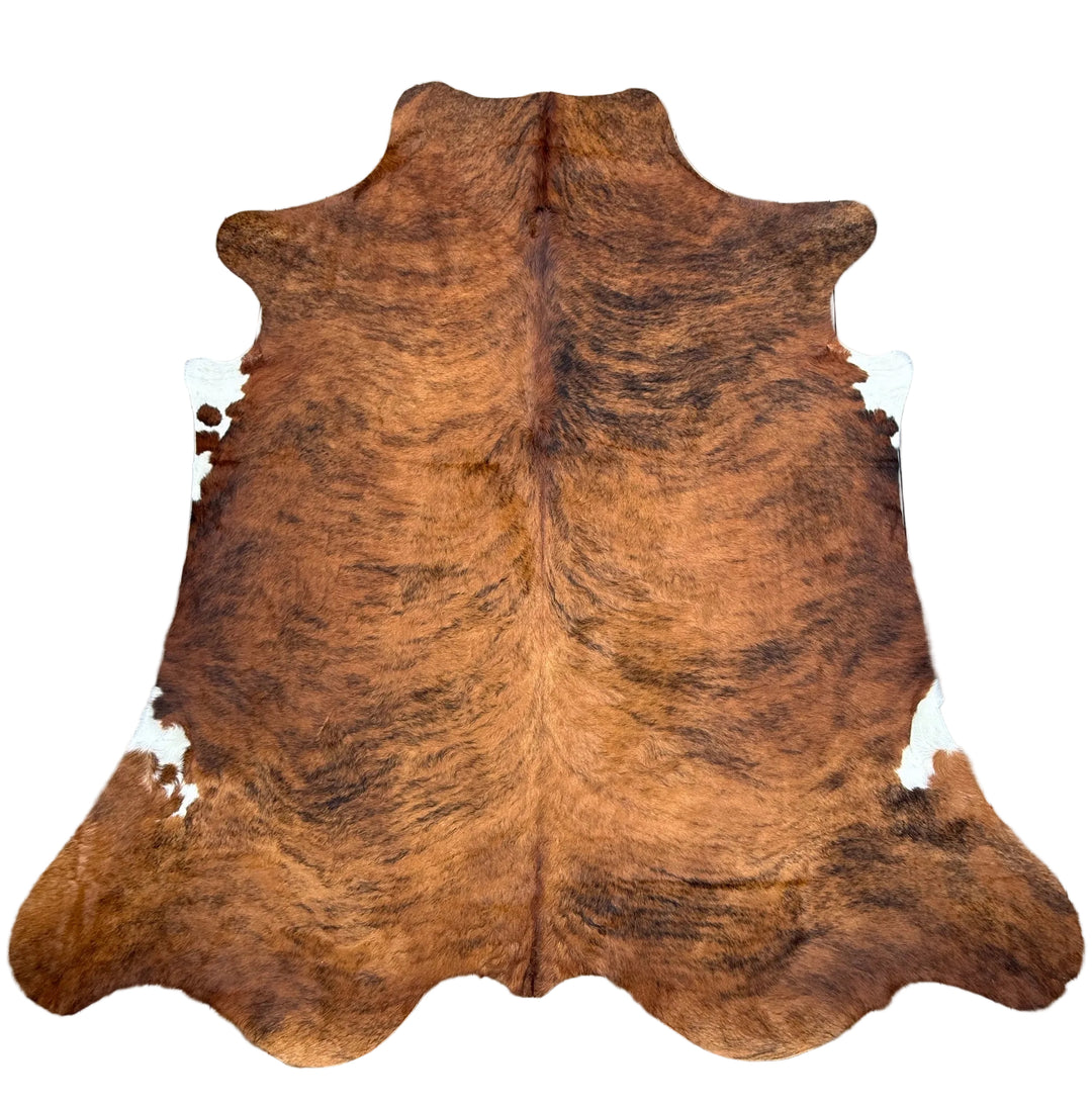 Large brown and black cowhide rug with white natural hide, measuring 250x236cm, from Cowhide Rugs London.