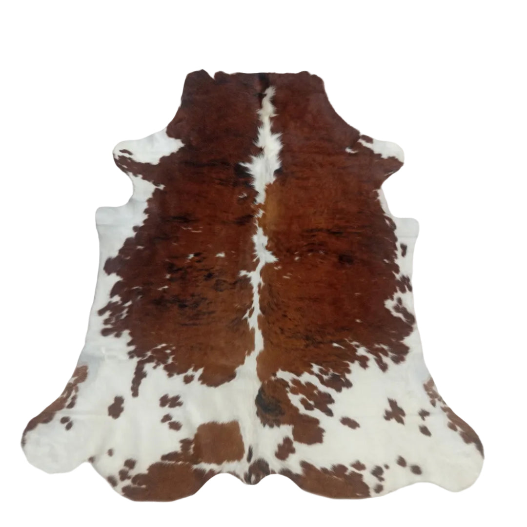 Large natural tricolour cowhide rug from Cowhide Rugs London, measuring 220x203cm, featuring a distinctive pattern and soft texture.