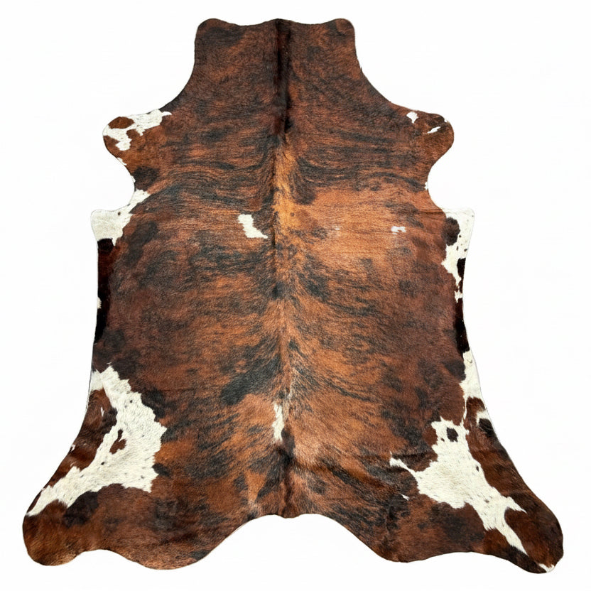 Extra large Brazilian tricolour cowhide rug from Cowhide Rugs London, 260x220cm, with distinctive natural patterns and coloration.