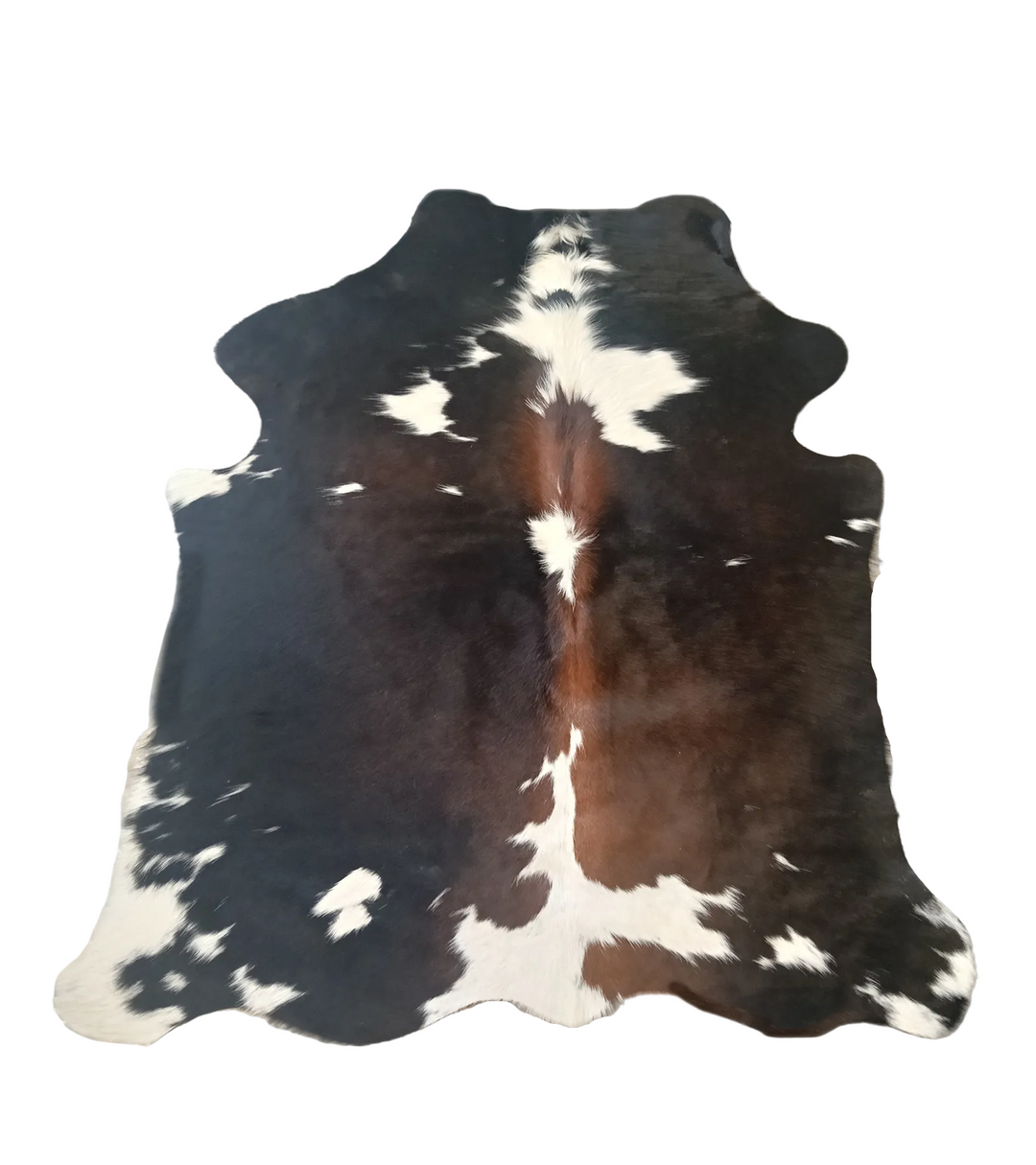 A natural black and white cowhide rug 