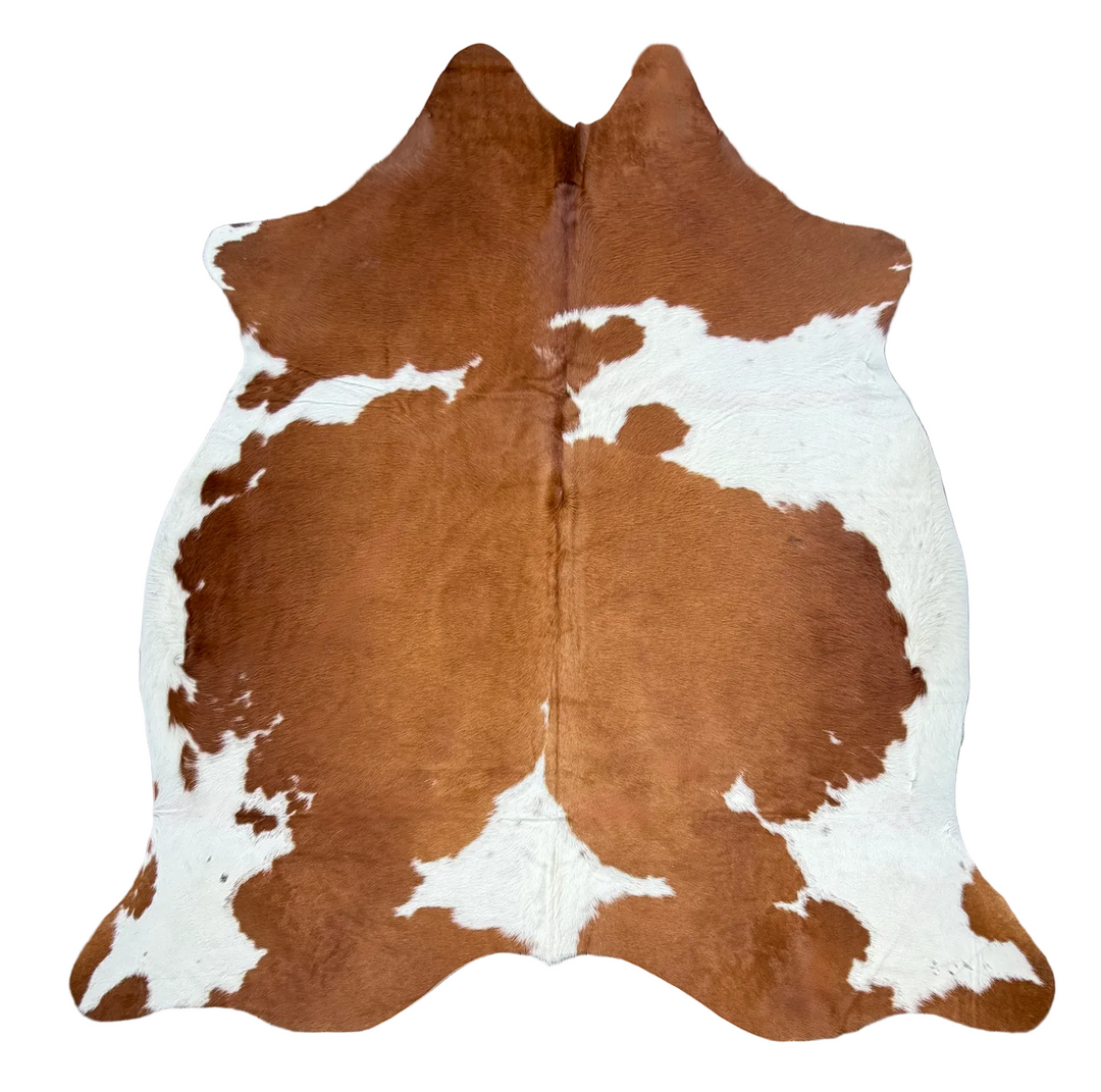 Brown and white cowhide rug