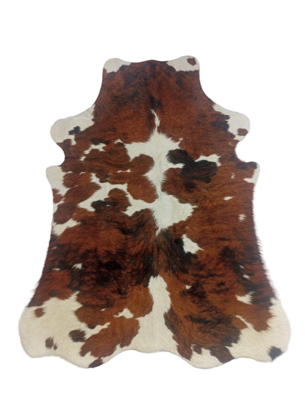 Brown and white cowhide rug 