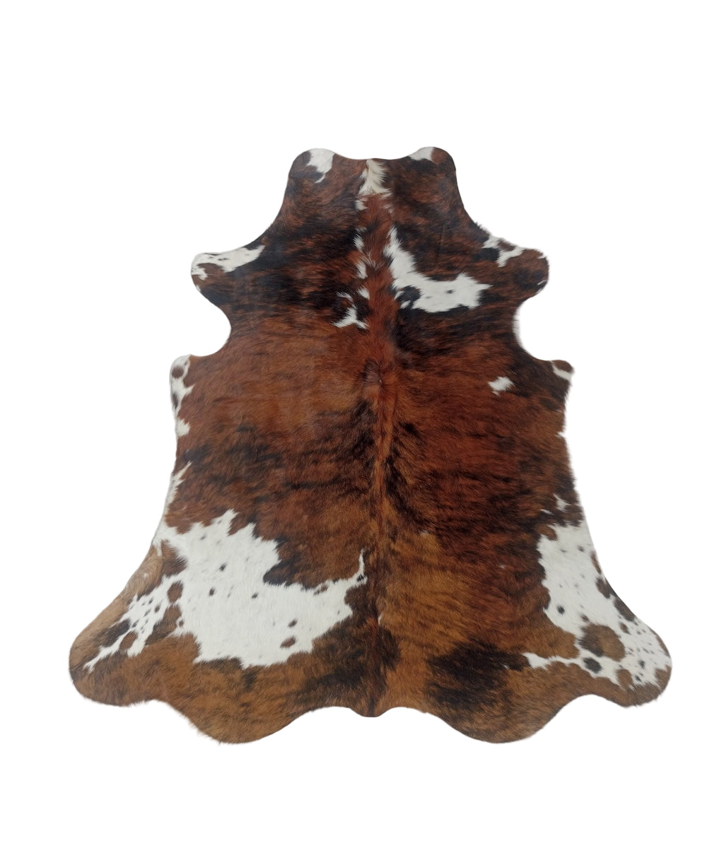 Brown and white cowhide rug 