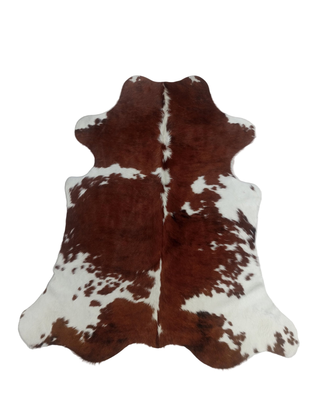 Brown and white cowhide rug 
