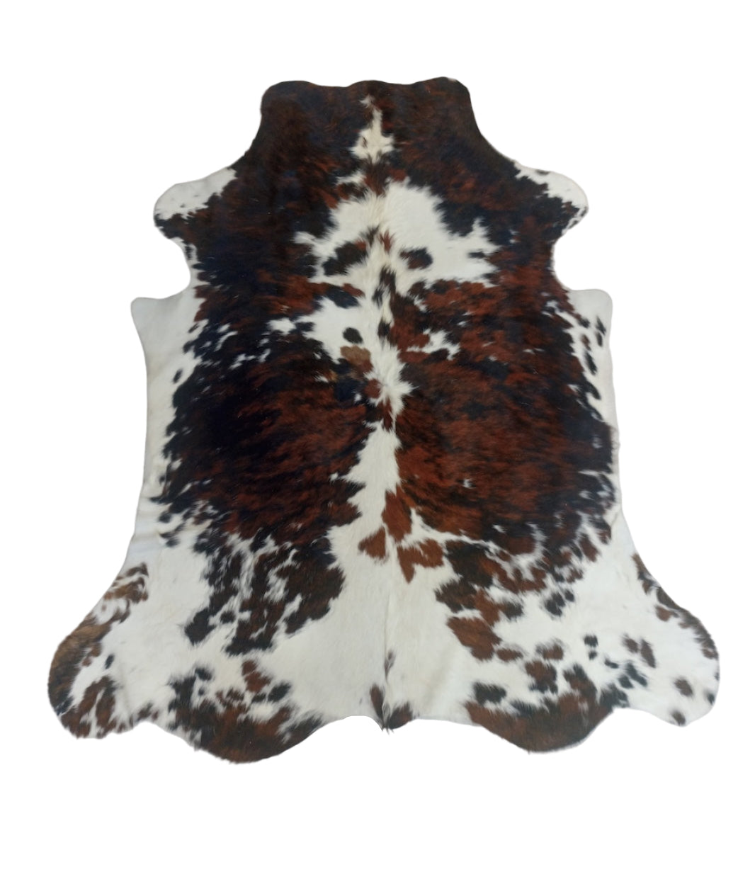 Brown and white cowhide rug 