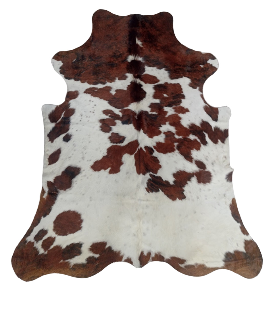 Cowhide rug with brown and white pattern 