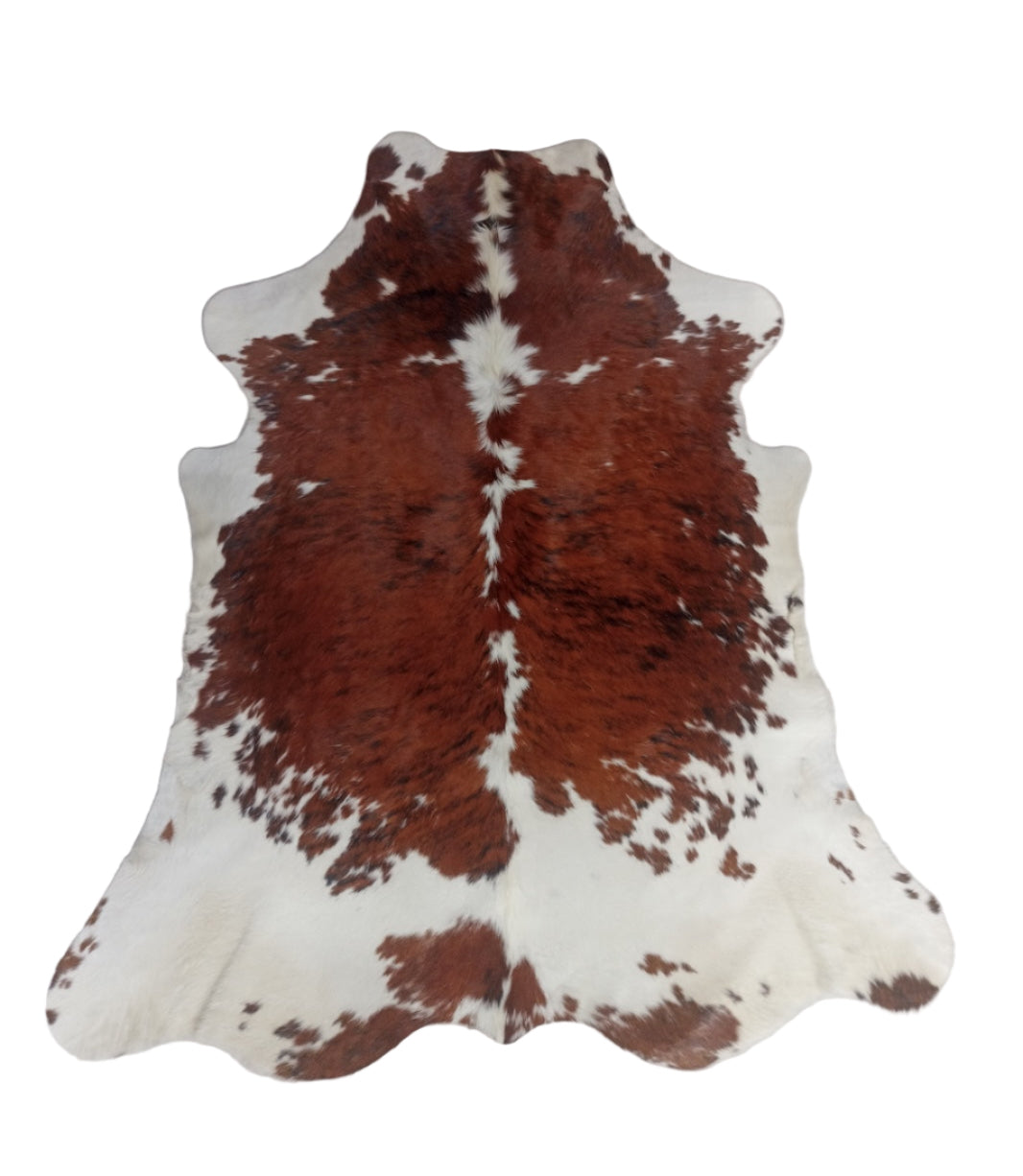 Brown and white cowhide rug 