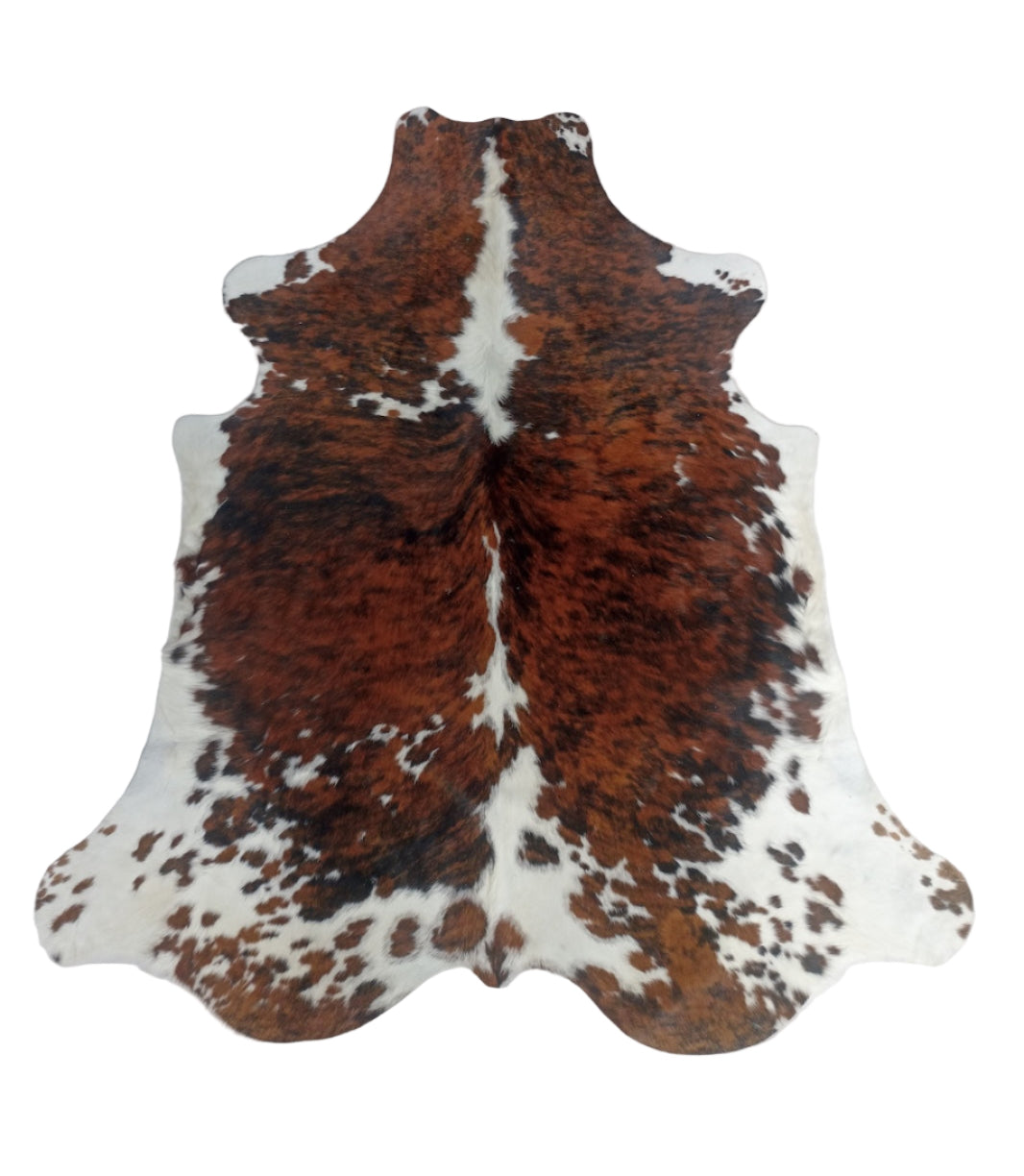Brown and white cowhide rug 