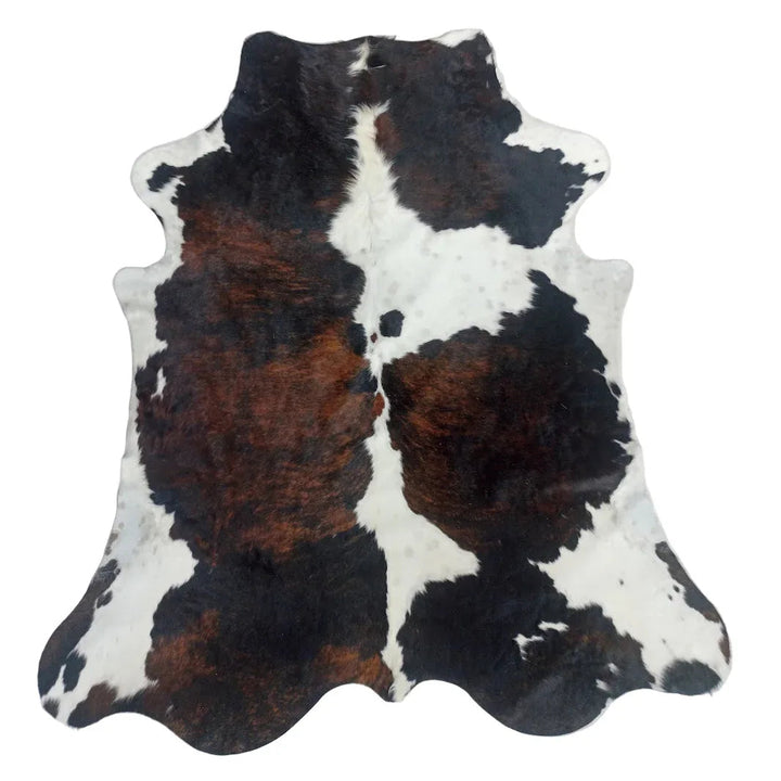 Large premium cowhide rug from Cowhide Rugs London, 245cm x 210cm, featuring natural cowhide pattern and rich texture.