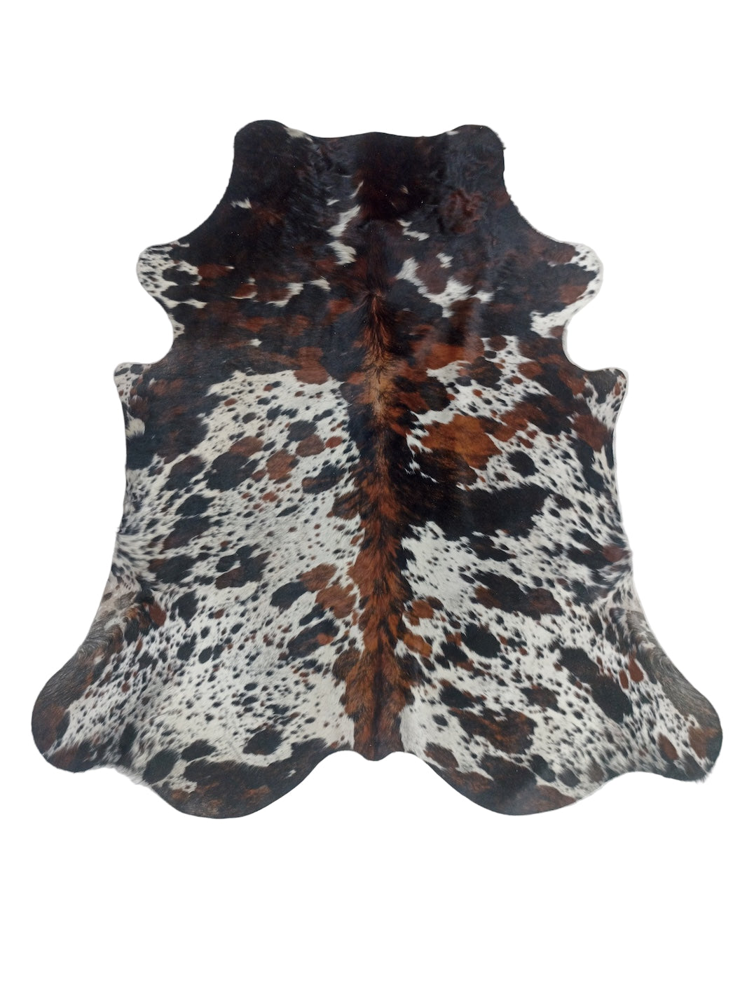 Cowhide rug with black, brown, and white pattern 