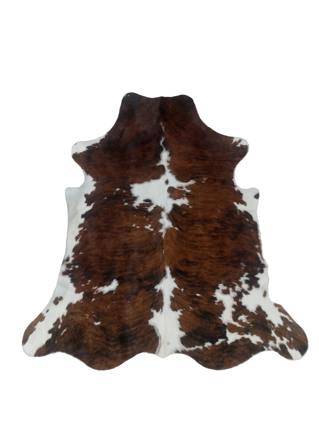Brown and white cowhide rug 