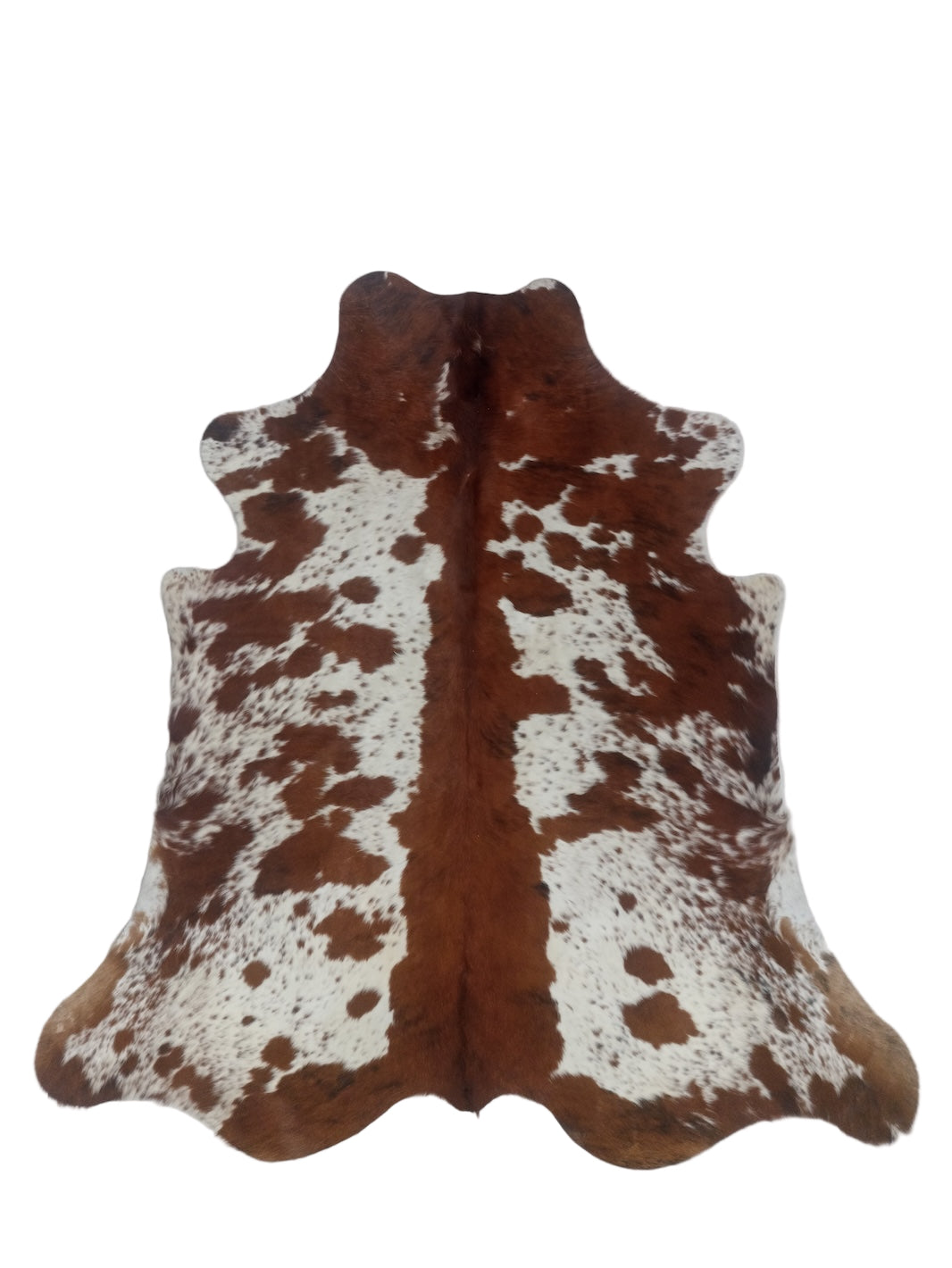 Brown and white cowhide rug 