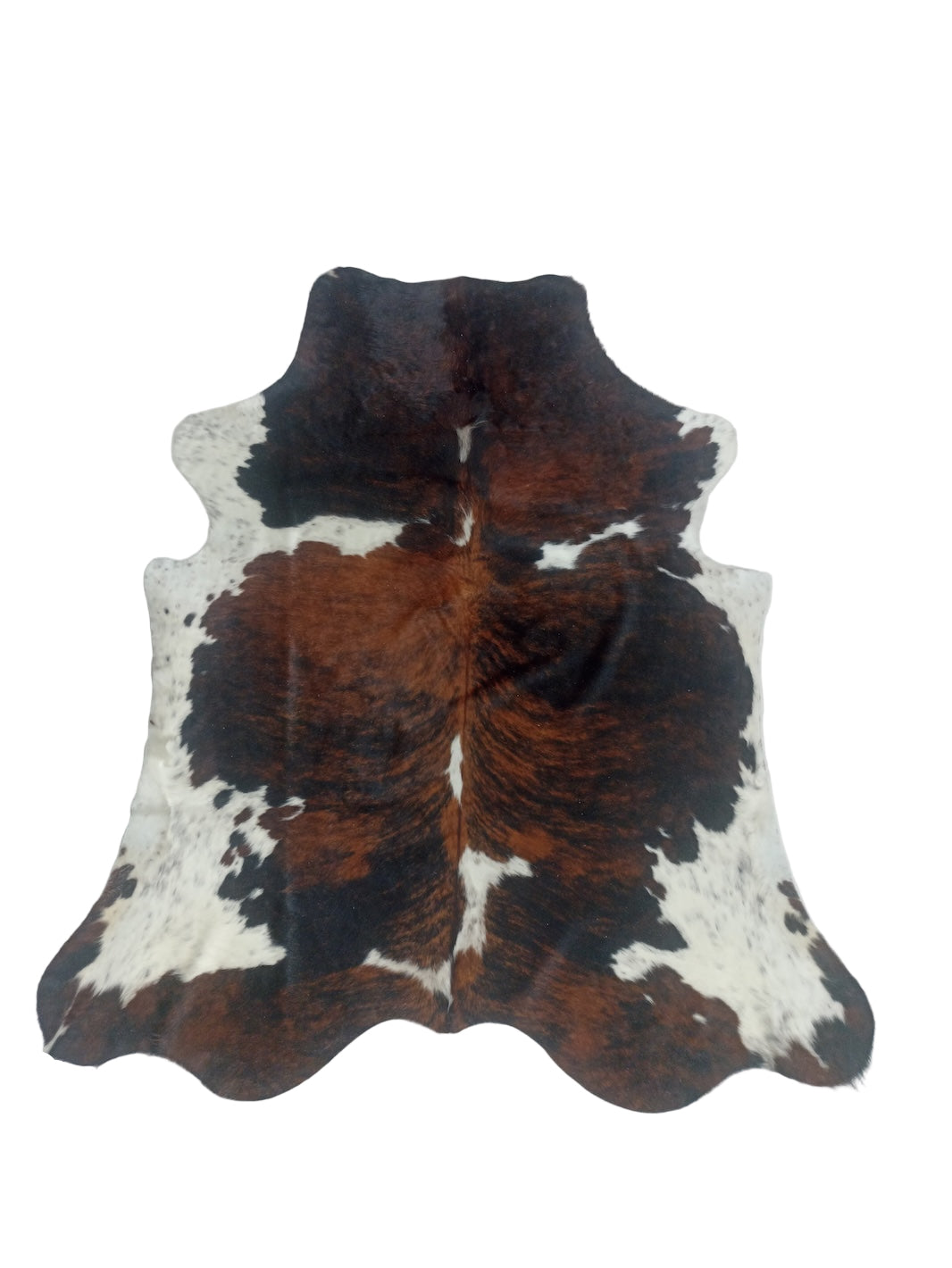 Cowhide rug with brown, black, and white 