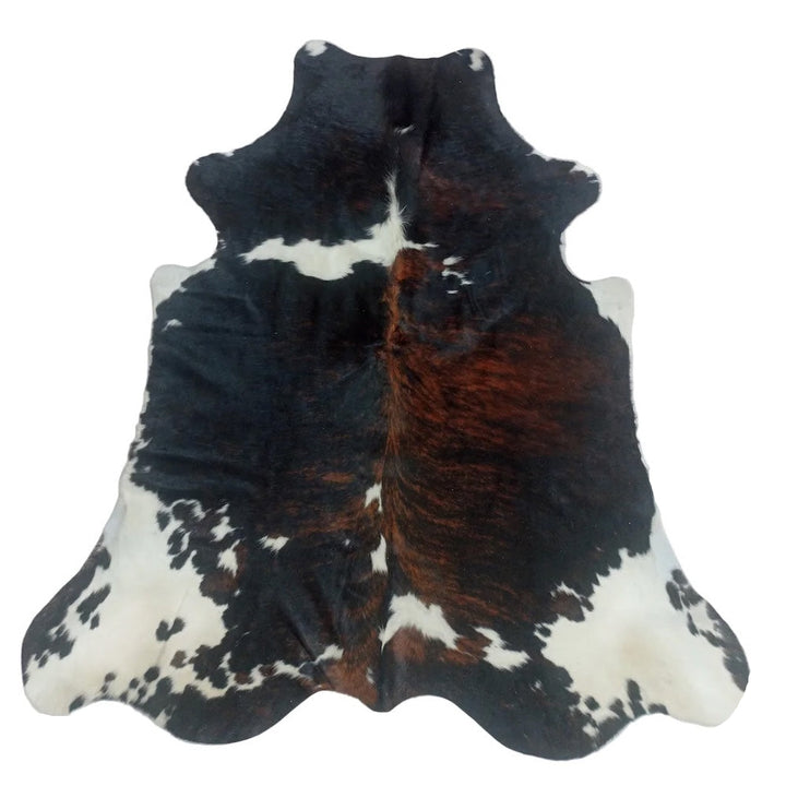 Black, white, and brown cowhide rug 