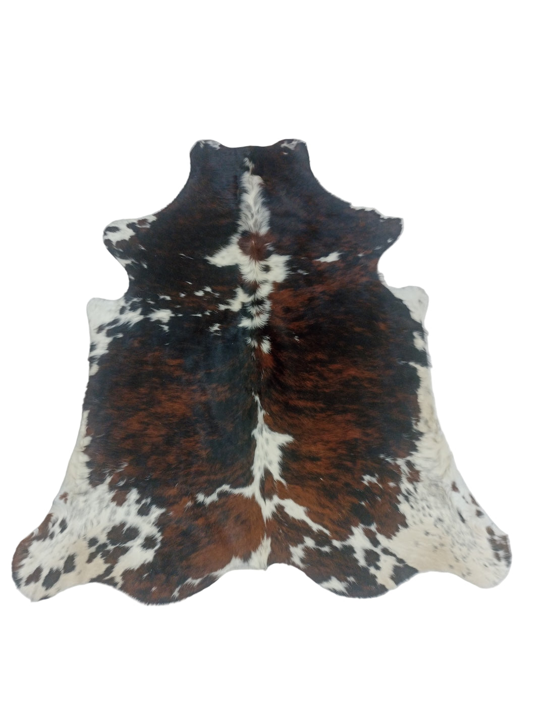 Cowhide rug with black, brown, and white pattern