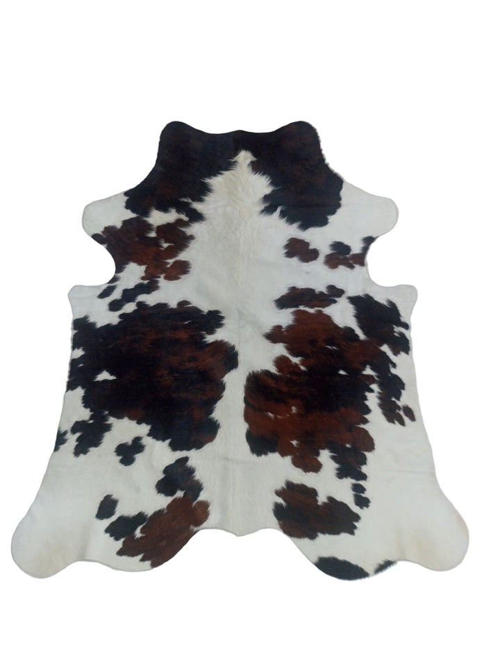 Cowhide rug with black and brown patches