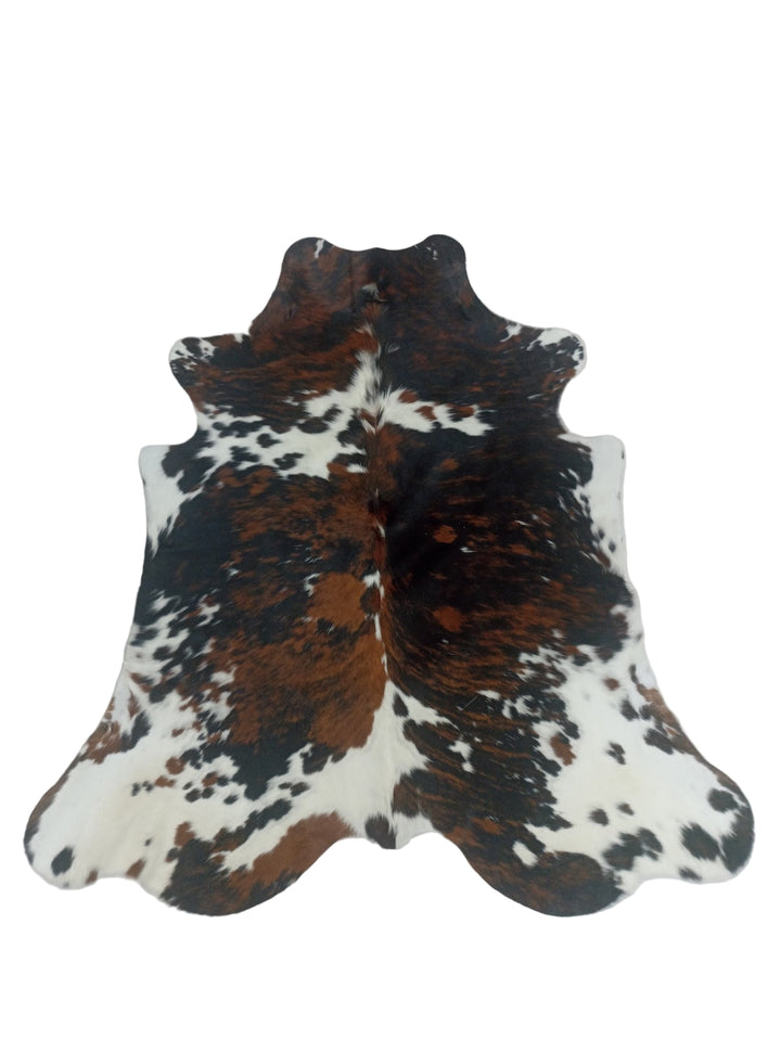 Cowhide rug with brown, black, and white pattern
