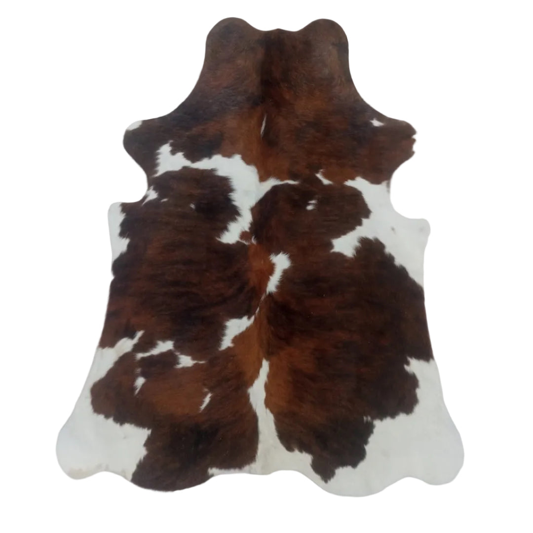 Brown and white cowhide rug 