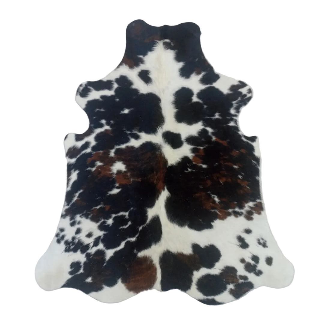 Cowhide rug with black, brown, and white 