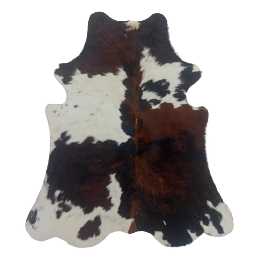 Cowhide rug with black, brown, and white pattern 