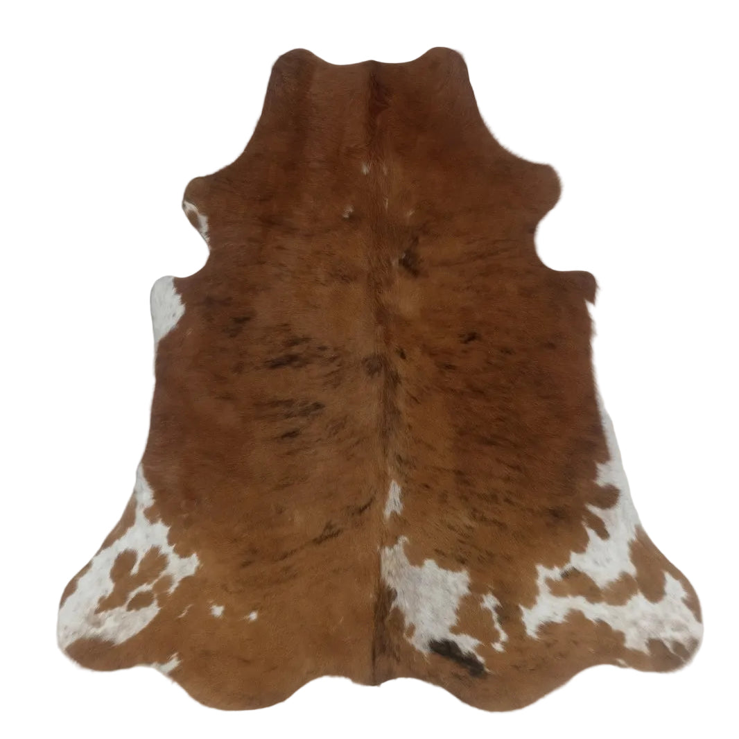 Brown and white cowhide rug 