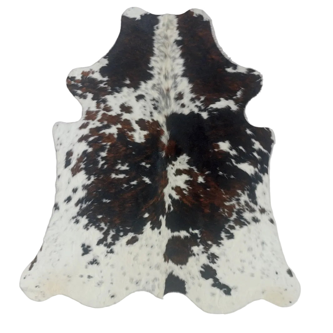 Cowhide rug with black, brown, and white 