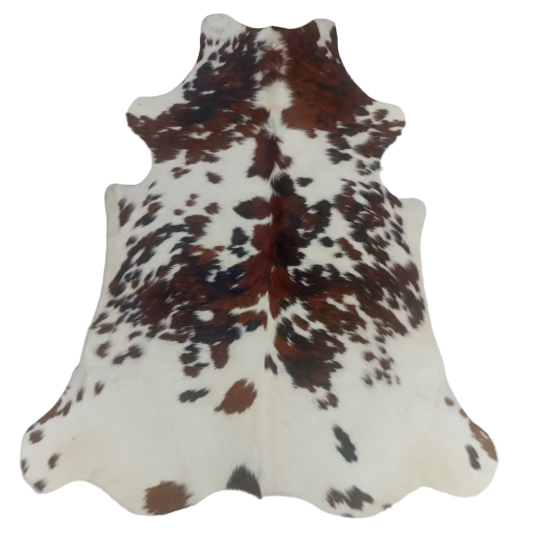Brown and white cowhide rug 