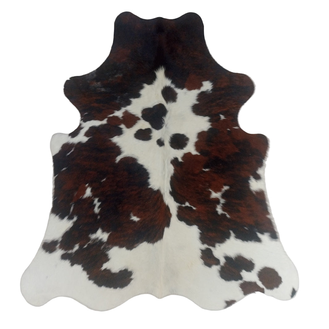 Brown and white cowhide rug