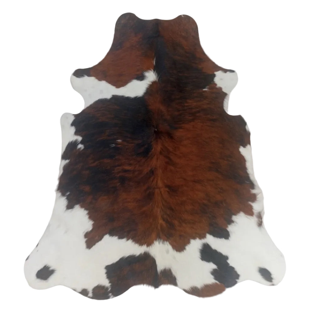 Brown, black, and white cowhide rug 