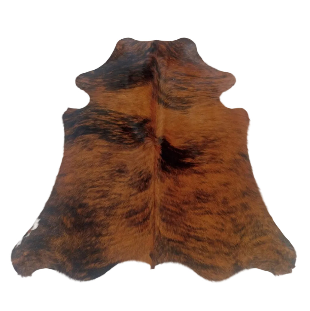 A natural cowhide rug with a brown and black mottled pattern.