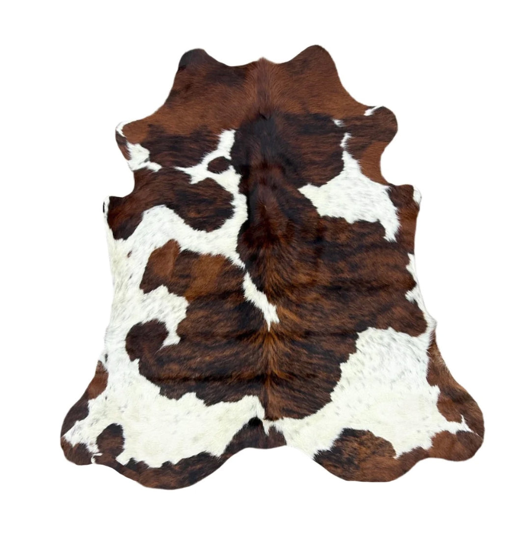 Brown and white cowhide rug 