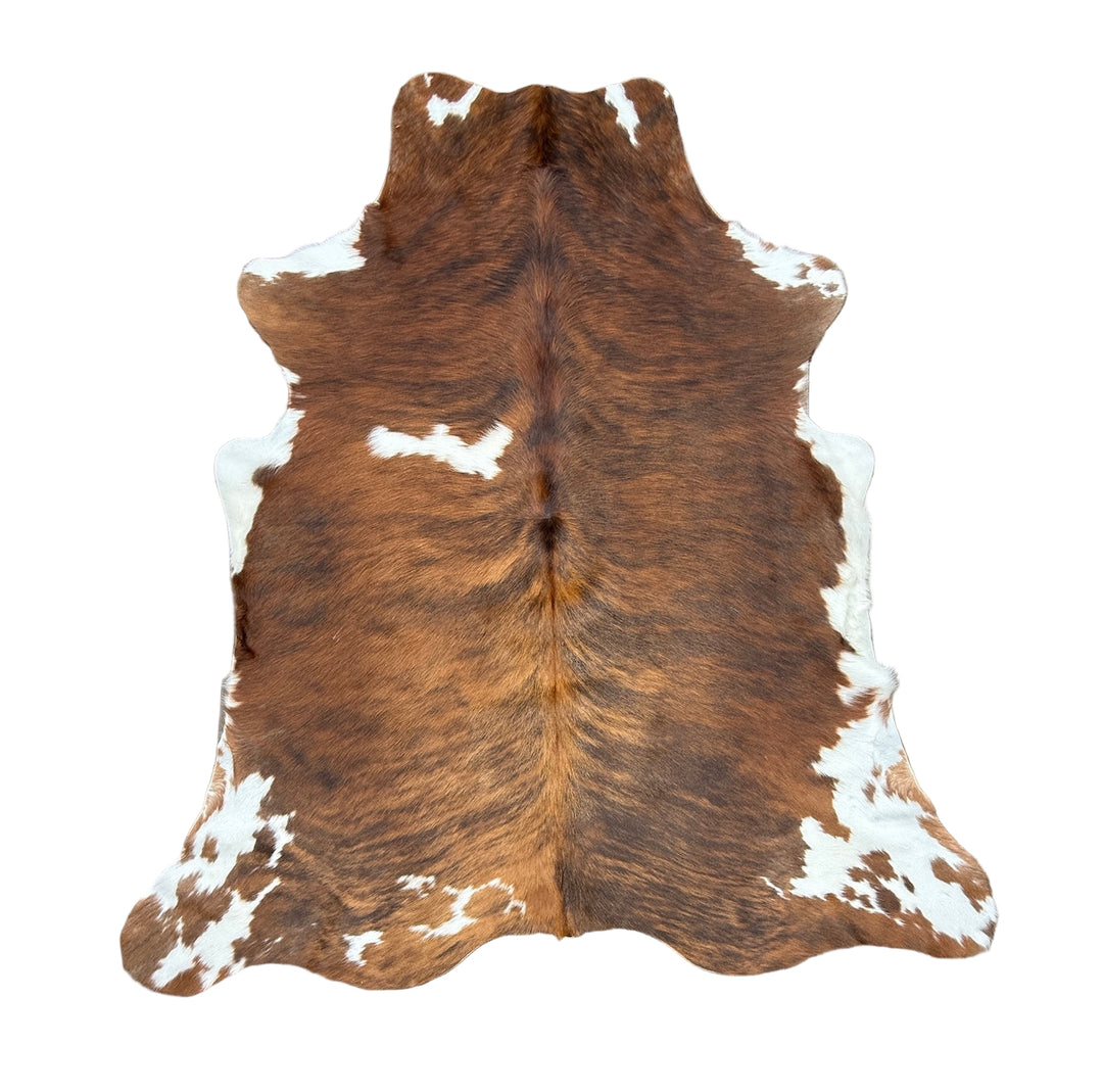 Brown and white cowhide rug 
