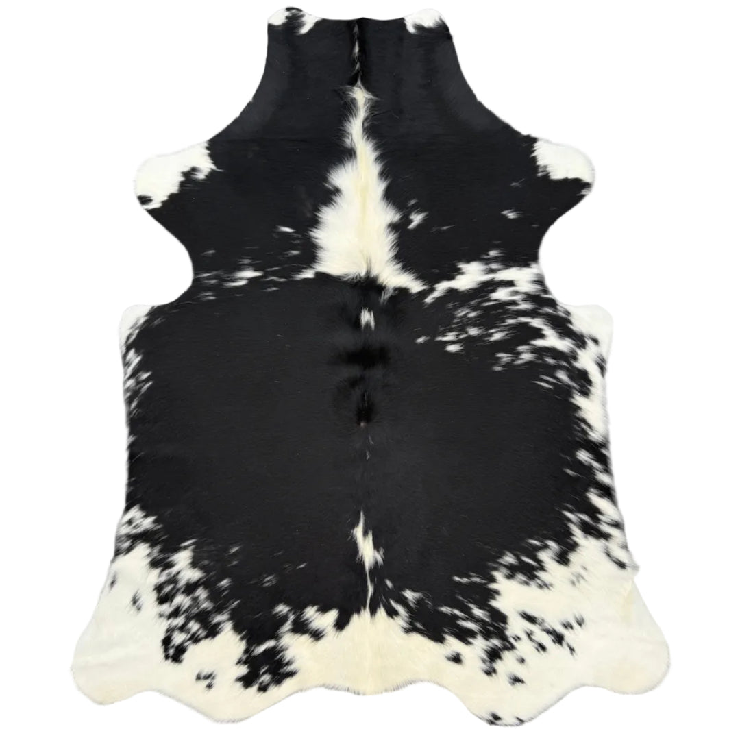 A black and white cowhide rug 